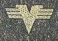 Former logo of the Volksbanken, displayed on a pavement in Freiburg im Breisgau