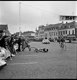Walter Godefroot crashing across the finish line. Peter Post finishing alongside him.