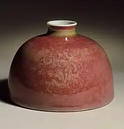 The related copper oxide peach-bloom glaze on a Kangxi water pot, also with incised decoration.