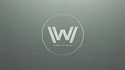 The letter "W" inside a circle as white text on a grey background.
