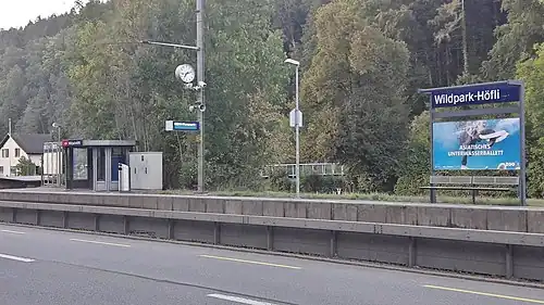 Single side platform next to the track in front of a roadway