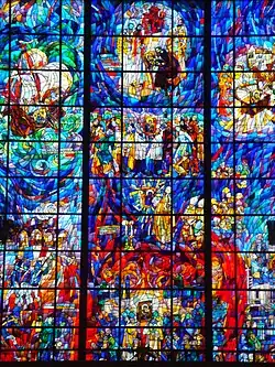 Stained glass in the back of the church. History of the image/icon of the Mother of God of the Incessant Help