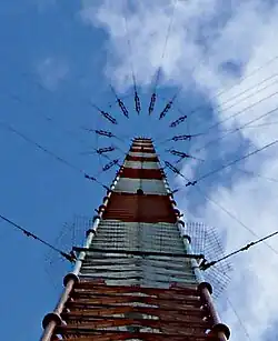 Top of 432&nbsp;m mast of station&nbsp;G Omega antenna, Victoria, Australia, showing insulators attaching the 16&nbsp;umbrella wires to the mast
