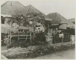 Exterior of some of the houses of Tjideng internment camp (1945). Each house accommodated as many as twenty women and children.