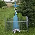 Krzyż przydrożny przy wjeździe do wsi