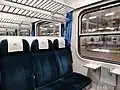 Wnętrze przedziału w&nbsp;wagonie drugiej klasy w pociągu TLK
