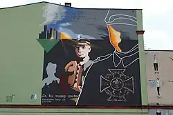 Mural na zachodniej ścianie kamienicy upamiętniający Jerzego Lisa (2024)