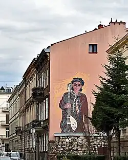 Mural poświęcony Andrzejowi Bieniaszowi, muzykowi Püdelsów.Kraków ul. Koletek 8