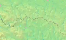 Mapa konturowa Beskidu Niskiego, u góry po lewej znajduje się czarny trójkącik z opisem „Homola”