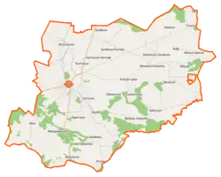 Mapa konturowa gminy Bieżuń, blisko centrum na lewo u góry znajduje się punkt z opisem „Karniszyn”