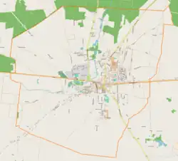 Mapa konturowa Brzezin, w centrum znajduje się punkt z opisem „Kościół Podwyższenia Świętego Krzyża”