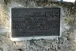 Tablica upamiętniająca 750 lat parafii i kościoła