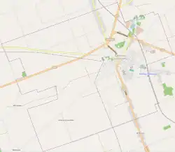 Mapa konturowa Dąbrowy Białostockiej, blisko centrum na prawo znajduje się punkt z opisem „Kościół świętego Stanisława w Dąbrowie Białostockiej”