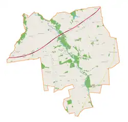 Mapa konturowa gminy Dmosin, blisko centrum na lewo znajduje się punkt z opisem „Lubowidza”