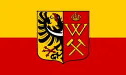 Historyczna flaga Królewskiej Huty z herbem