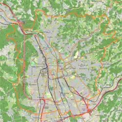 Mapa konturowa Grazu, w centrum znajduje się punkt z opisem „Uniwersytet Karola i&nbsp;Franciszka w&nbsp;Grazu”
