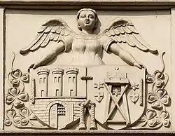 Połączone herby Starego i Nowego Miasta Torunia na fasadzie kamienicy przy ul. św. Katarzyny 4