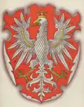 Herb województwa krakowskiego w wykonaniu Stanisława Eljasz-Radzikowskiego na jednej z pocztówek wydanych przez Towarzystwo Szkoły Ludowej (1910).