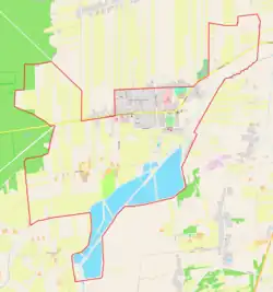 Mapa konturowa Jadowa, blisko centrum na prawo u góry znajduje się punkt z opisem „Parafia św. Jakuba Apostoła”