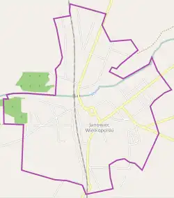 Mapa konturowa Janowca Wielkopolskiego, w centrum znajduje się punkt z opisem „Parafia św. Mikołaja”