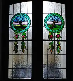 Witraż z medalionami z motywem krajobrazów,Kraków,  ul. Garncarska  5,drzwi na klatkę schodową