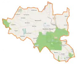 Mapa konturowa gminy Kazimierz Biskupi, blisko centrum po prawej na dole znajduje się punkt z opisem „Bieniszew-Klasztor”