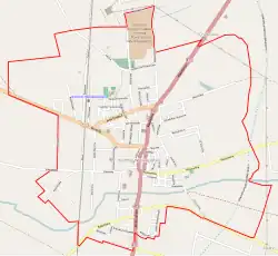 Mapa konturowa Koźmina Wielkopolskiego, w centrum znajduje się punkt z opisem „Parafia pod wezwaniem świętego Stanisława”