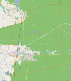 Mapa konturowa Kuźni Raciborskiej, blisko centrum po lewej na dole znajduje się punkt z opisem „Parafia św. Marii Magdalenyw Kuźni Raciborskiej”