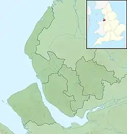 Mapa konturowa Merseyside, blisko centrum na dole znajduje się punkt z opisem „źródło”, natomiast po lewej znajduje się punkt z opisem „ujście”
