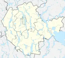 Mapa konturowa powiatu mrągowskiego, po lewej nieco na dole znajduje się punkt z opisem „Piłaki”