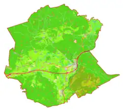 Mapa konturowa gminy Postojna, blisko centrum na prawo znajduje się punkt z opisem „Postojna”