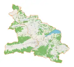 Mapa konturowa gminy Myślenice, blisko centrum na dole znajduje się punkt z opisem „Tele-Fonika Kable”
