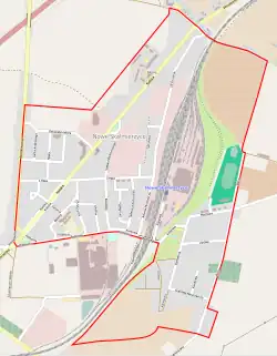 Mapa konturowa Nowych Skalmierzyc, blisko centrum na lewo znajduje się punkt z opisem „Parafia Bożego Ciała”