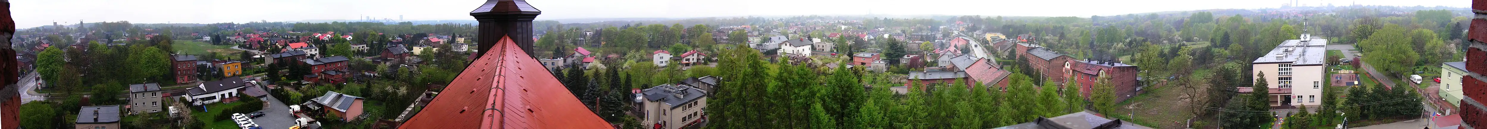 Panorama Pawłowa z wieży kościoła św. Pawła Apostoła - z lewej strony ul. Sikorskiego w kierunku Pawłowa-Szybu, z prawej strony, po minięciu ul. Sikorskiego w kierunku Kończyc, panorama kończy się na ZSP nr 6.