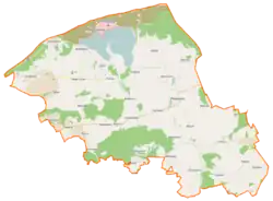 Mapa konturowa gminy Postomino, blisko centrum na prawo znajduje się punkt z opisem „Postomino”