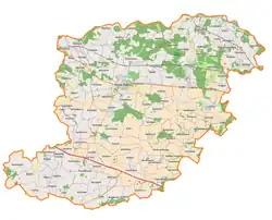 Mapa konturowa powiatu średzkiego, u góry po prawej znajduje się ikonka zamku z wieżą z opisem „Zamek w Wojnowicach”