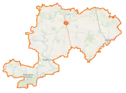 Mapa konturowa powiatu grójeckiego, po prawej znajduje się punkt z opisem „Warka”