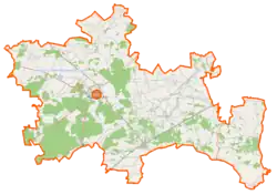 Mapa konturowa powiatu ostrowskiego, na dole nieco na lewo znajduje się punkt z opisem „Brok”