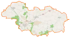 Mapa konturowa powiatu rawickiego, blisko centrum po lewej na dole znajduje się punkt z opisem „Rawicz”