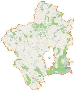 Mapa konturowa powiatu suwalskiego, na dole znajduje się punkt z opisem „Raczki”