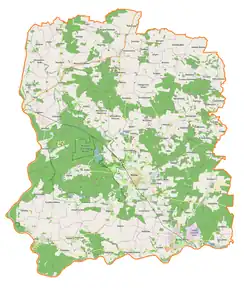 Mapa konturowa powiatu wołowskiego, blisko centrum na lewo znajduje się punkt z opisem „Uroczysko Wrzosy”