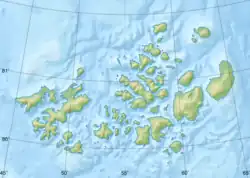 Mapa konturowa Ziemi Franciszka Józefa, u góry nieco na prawo znajduje się punkt z opisem „Wyspa Rudolfa”