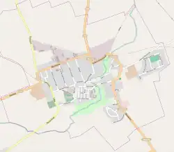 Mapa konturowa Reszla, blisko centrum na dole znajduje się ikonka zamku z wieżą z opisem „Zamek w Reszlu”