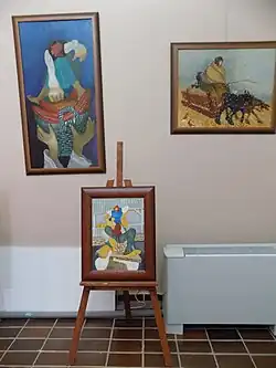 Obrazek po lewej stronie i obrazek na sztalugach