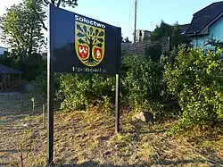 Herb gminy przy plaży w Rosnówku