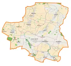 Mapa konturowa gminy Ruja, blisko centrum na dole znajduje się punkt z opisem „Tyniec Legnicki”