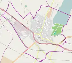 Mapa konturowa Słupcy, blisko centrum u góry znajduje się punkt z opisem „Kościół bł. Michała Kozala w Słupcy”
