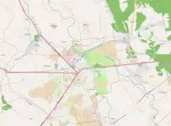 Mapa konturowa Sieradza, blisko dolnej krawiędzi znajduje się punkt z opisem „Monice”