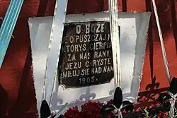 Tablica pod krzyżem na rozstaju dróg do Urszulina i Nowego Załucza