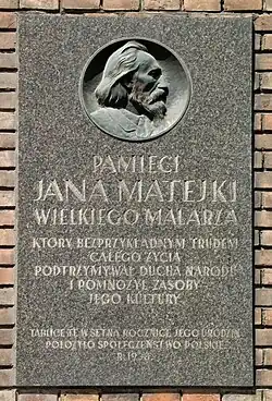 Tablica upamiętniająca Jana Matejkę wmurowana w ścianę ASP